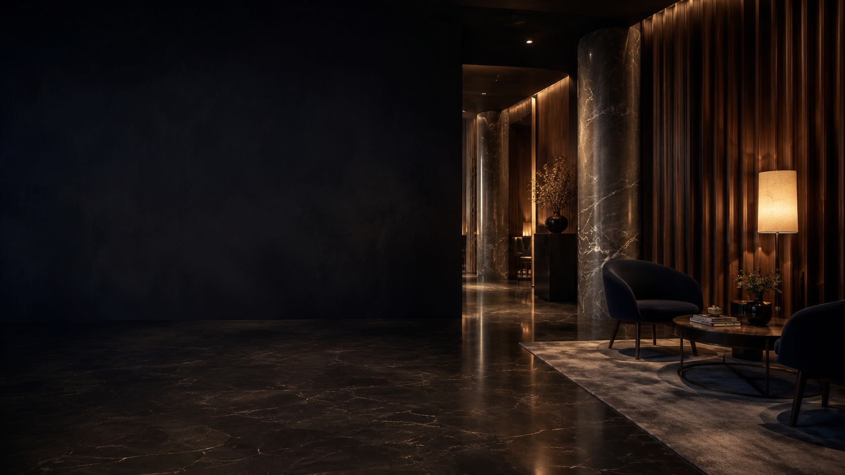 A quiet, dimly lit clinic lounge with empty chairs waiting under warm light