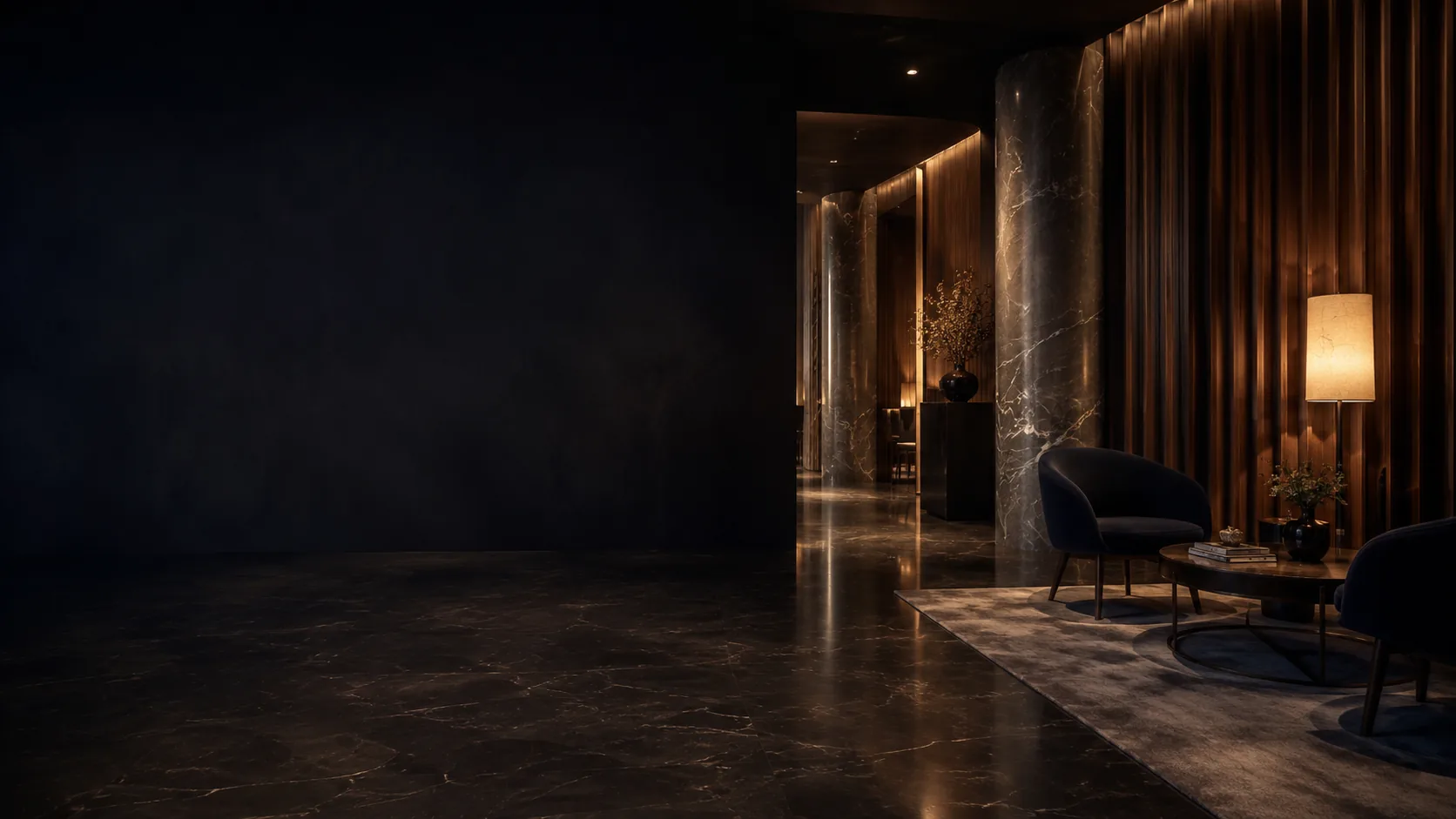 A quiet, dimly lit clinic lounge with empty chairs waiting under warm light